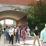 Faculty pass under the arch